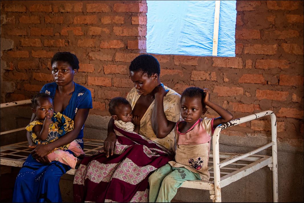 Children and mothers wait for doctor's consultation